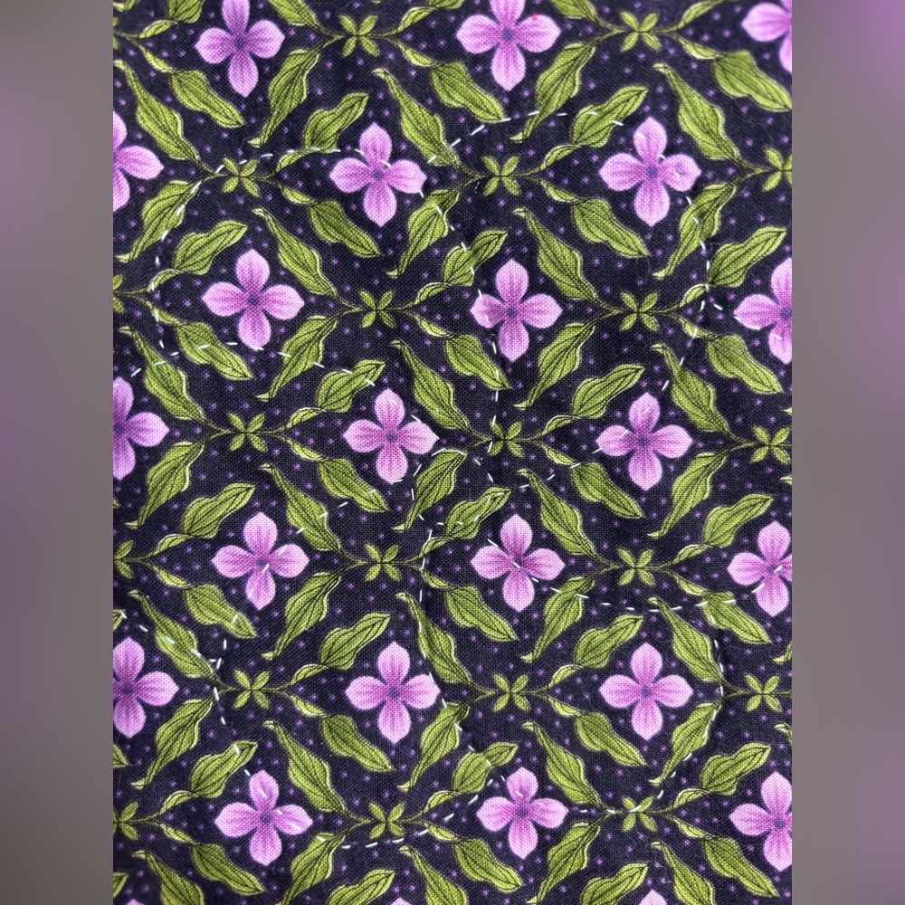 Beautiful hand made Quilt floral pattern reverses to green and has piqued edge